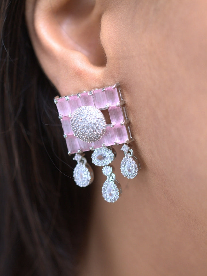 A woman showcasing a beautiful artificial diamond necklace with mint pink colored stone and earrings set, ideal for festivals, family gatherings, and special celebrations in India. This elegant diamond jewelry provides the perfect blend of sparkle and tradition, with a modern twist.