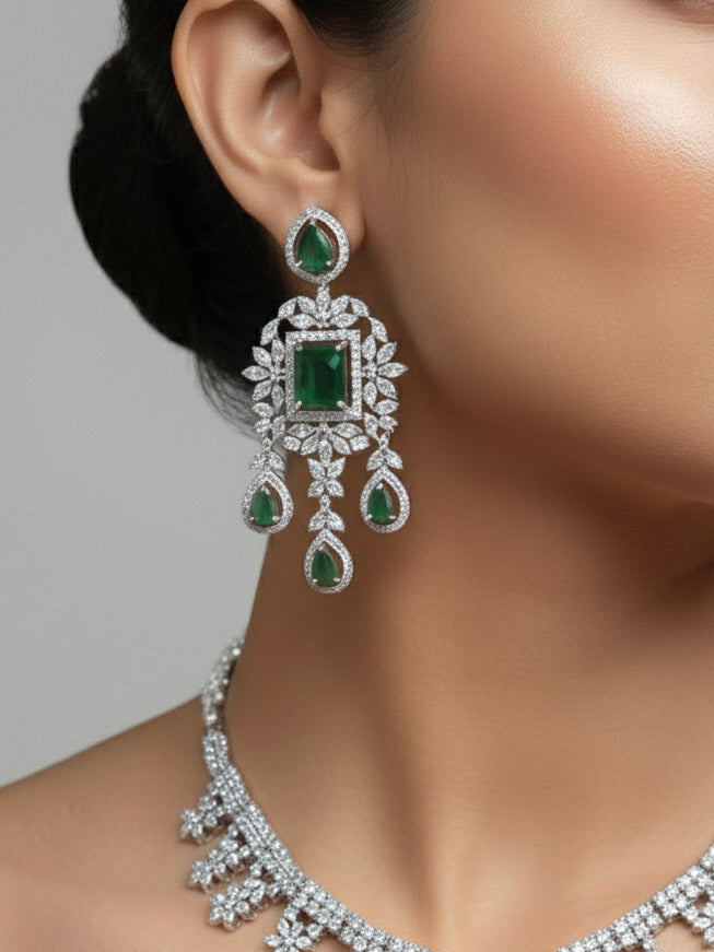 "A woman showcasing a beautiful artificial diamond necklace with green colored stone and earrings set, ideal for festivals, family gatherings, and special celebrations in India. This elegant diamond jewelry provides the perfect blend of sparkle and tradition, with a modern twist."