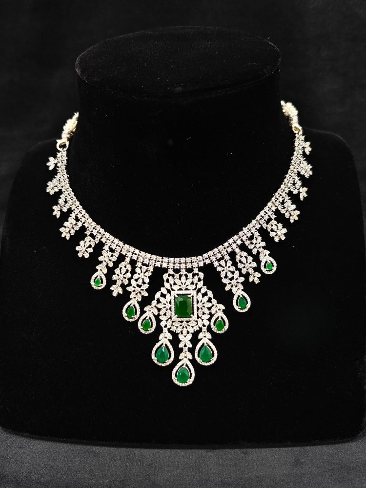 "An elegant artificial diamond necklace with green colored stone and matching earrings. This premium artificial diamond jewelry set is perfect for special occasions, from Indian weddings to engagement parties, offering sophisticated glamour without the high price tag."