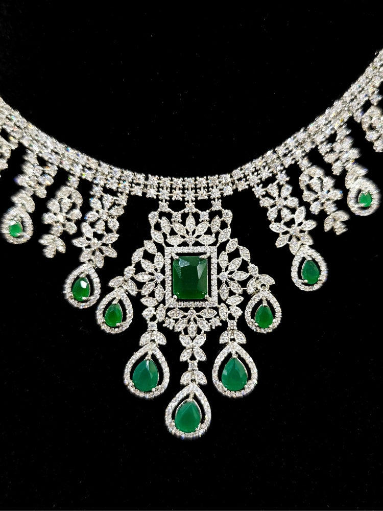  "An elegant artificial diamond necklace with green colored stone and matching earrings. This premium artificial diamond jewelry set is perfect for special occasions, from Indian weddings to engagement parties, offering sophisticated glamour without the high price tag."