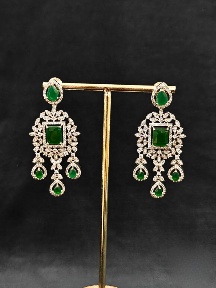 "An elegant artificial diamond necklace with green colored stone and matching earrings. This premium artificial diamond jewelry set is perfect for special occasions, from Indian weddings to engagement parties, offering sophisticated glamour without the high price tag."