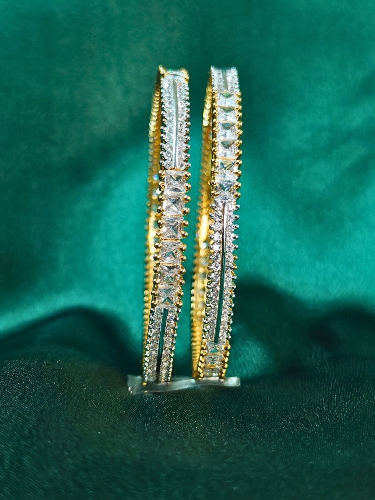 Close-up of an ornate Indo-Western (Gold Polish) Diamond Bangles with American Diamond. Cocktail party outfit paired with sparkling artificial American Diamond Bangles. Elegant party wear styled with high-quality imitation American Diamond Bangles.