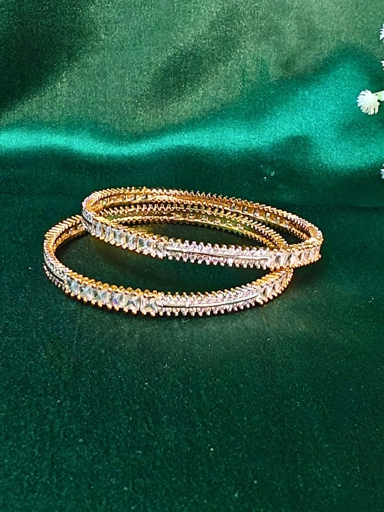 Close-up of an ornate Indo-Western (Gold Polish) Diamond Bangles with American Diamond. Cocktail party outfit paired with sparkling artificial American Diamond Bangles. Elegant party wear styled with high-quality imitation American Diamond Bangles.