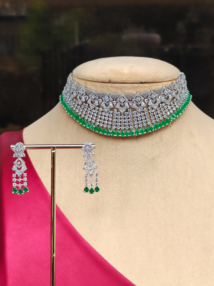 "Elegant woman wearing a luxurious artificial diamond and green colored stone necklace with matching earrings, perfect for high-profile wedding receptions and formal galas. This high-end artificial diamond jewelry set combines style, elegance, and affordability for special occasions."
