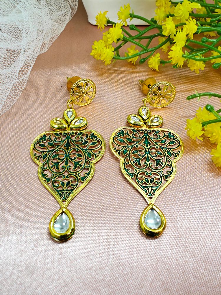 Close-up of an ornate traditional Green Meenakari Earrings with Kundan, Meeenakari and Filigree. Festive Diwali look styled with premium artificial Meenakari earrings. Close-up of anti-tarnish artificial Meenakari earrings for festive celebrations.