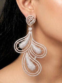 Close-up of a woman wearing an ornate Western American Diamond Rose Gold Earrings with American Diamond. Elegant party wear styled with high-quality imitation American Diamond earrings. Close-up of American diamond earrings styled for a reception party.