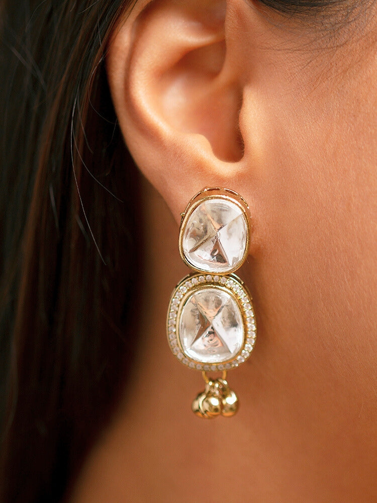 Make a bold style statement with this exquisite gold-tone statement necklace featuring a circular pendant adorned with emerald-green and crystal-white stones. Designed with intricate detailing and a regal finish, this necklace is perfect for weddings, festive occasions, and ethnic wear. Pair it with sarees, lehengas.