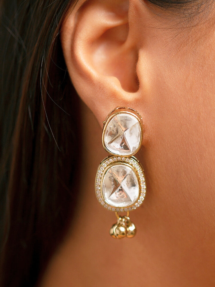 Make a bold style statement with this exquisite gold-tone statement necklace featuring a circular pendant adorned with emerald-green and crystal-white stones. Designed with intricate detailing and a regal finish, this necklace is perfect for weddings, festive occasions, and ethnic wear. Pair it with sarees, lehengas.