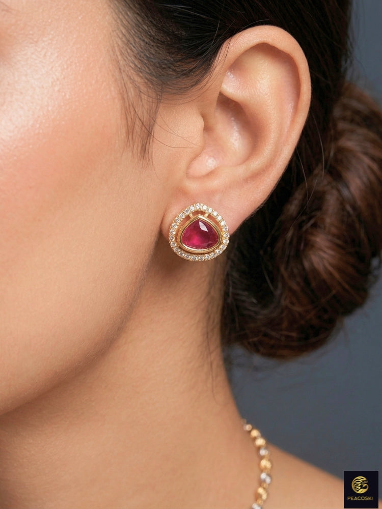 Close-up of a woman wearing an ornate Indo-western Ruby Pink (Carat Polish) Diamond Pendant set and earrings with American Diamonds, Colored Stones and Moissanite. Elegant festive look with a high-quality imitation American diamond Pendant set. Close-up of high-quality  artificial American Diamond necklace craftsmanship.