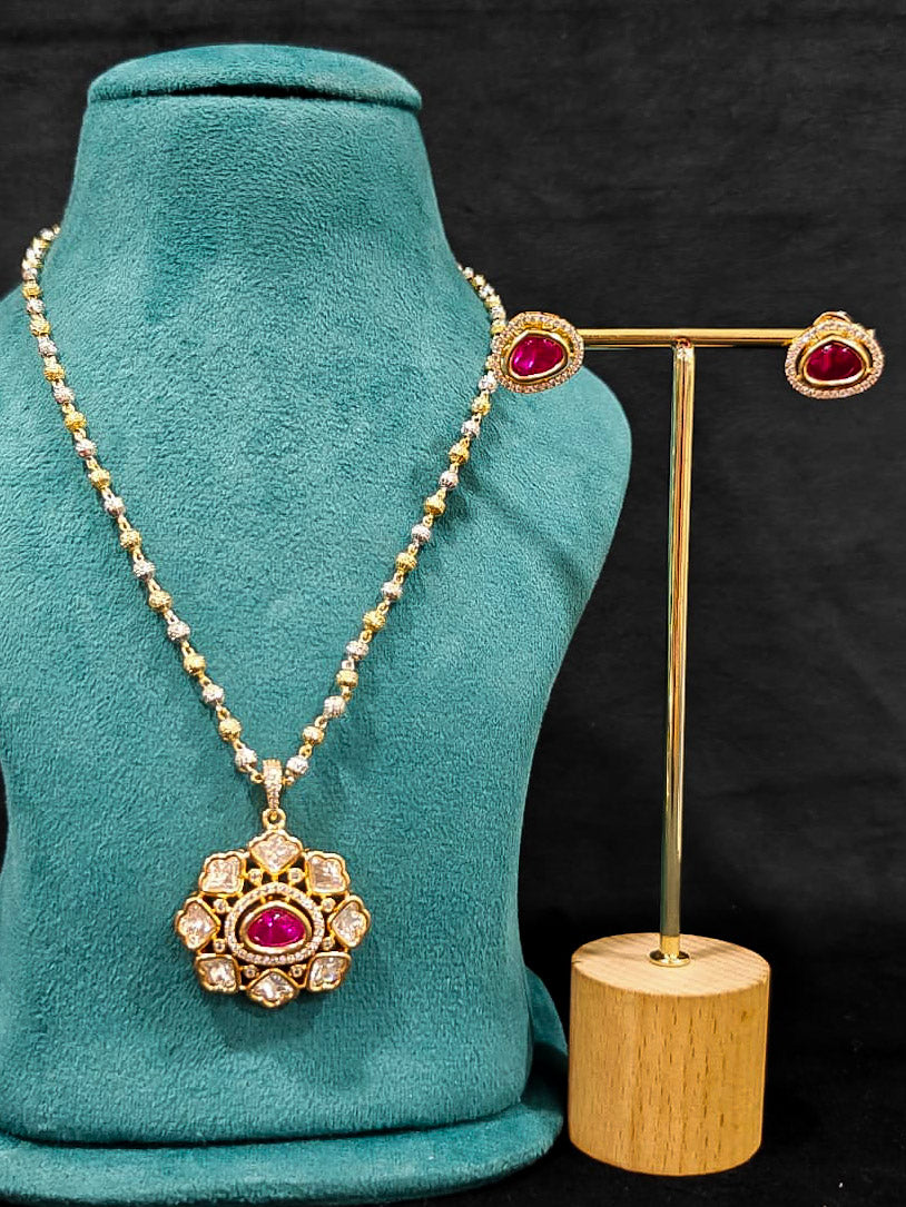 Close-up of an ornate Indo-western Ruby Pink (Carat Polish) Diamond Pendant set and earrings with American Diamonds, Colored Stones and Moissanite. Elegant festive look with a high-quality imitation American diamond Pendant set. Close-up of high-quality  artificial American Diamond necklace craftsmanship.