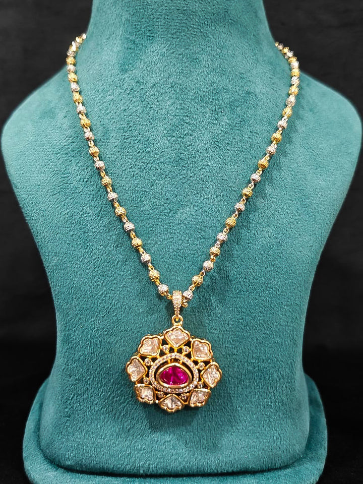 Close-up of an ornate Indo-western Ruby Pink (Carat Polish) Diamond Pendant set and earrings with American Diamonds, Colored Stones and Moissanite. Elegant festive look with a high-quality imitation American diamond Pendant set. Close-up of high-quality  artificial American Diamond necklace craftsmanship.