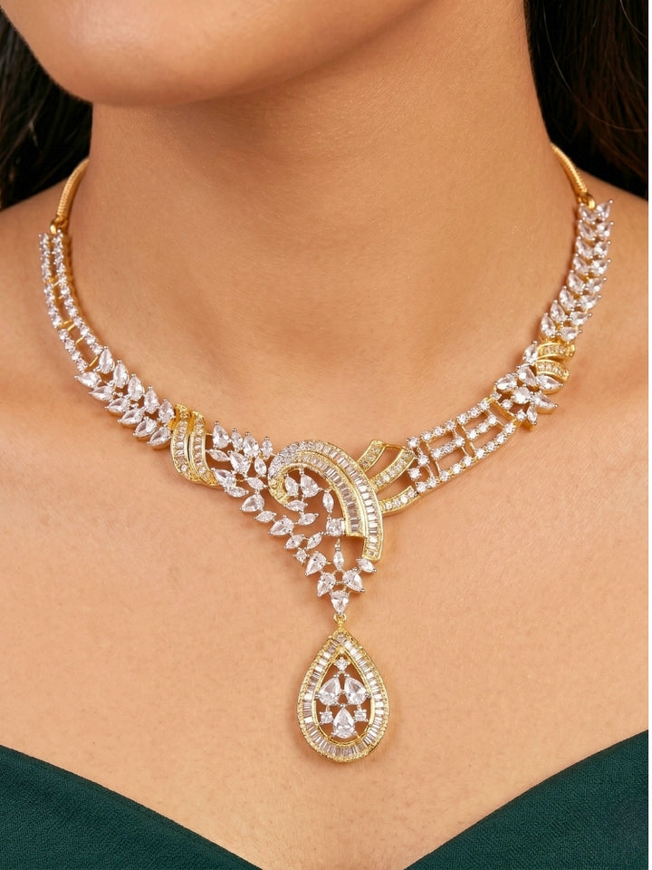 Close-up of a women wearing an ornate Western (Dual Tone) Gold & Silver Collar jewellery set and earrings with American Diamond. Party wear outfit completed with a lightweight American diamond necklace. Close-up of a cocktail party look featuring a premium American diamond necklace.