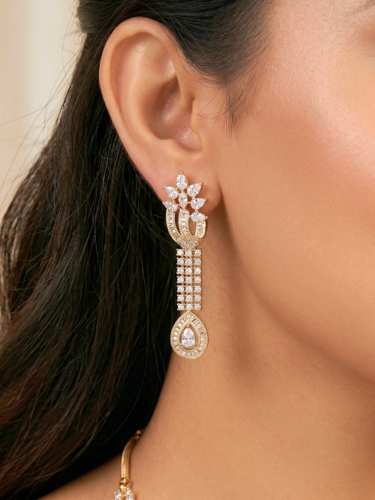 Close-up of a women wearing an ornate Western (Dual Tone) Gold & Silver Collar jewellery set and earrings with American Diamond. Party wear outfit completed with a lightweight American diamond necklace. Close-up of a cocktail party look featuring a premium American diamond necklace.