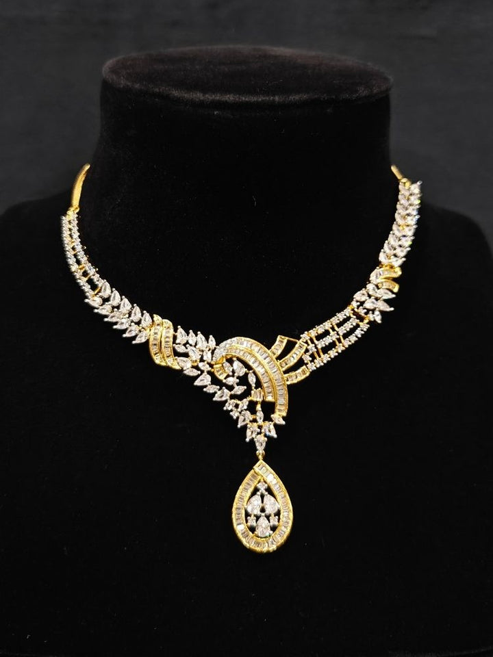 Close-up of an ornate Western (Dual Tone) Gold & Silver Collar jewellery set and earrings with American Diamond. Party wear outfit completed with a lightweight American diamond necklace. Close-up of a cocktail party look featuring a premium American diamond necklace.