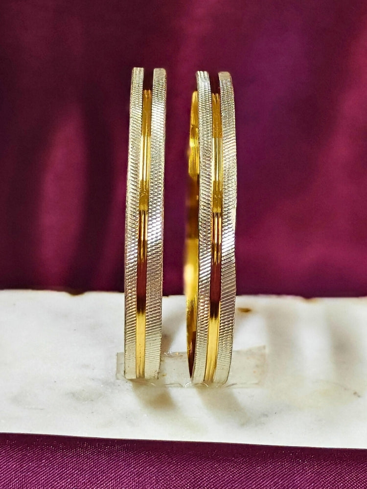Close-up of an ornate traditional (Gold Polish) White Bangles Set. It’s comfortable and lightweight enough for everyday wear, and it also looks absolutely beautiful and elegant. The design is stylish, the finish is impressive, and it feels really pleasant to wear all day.