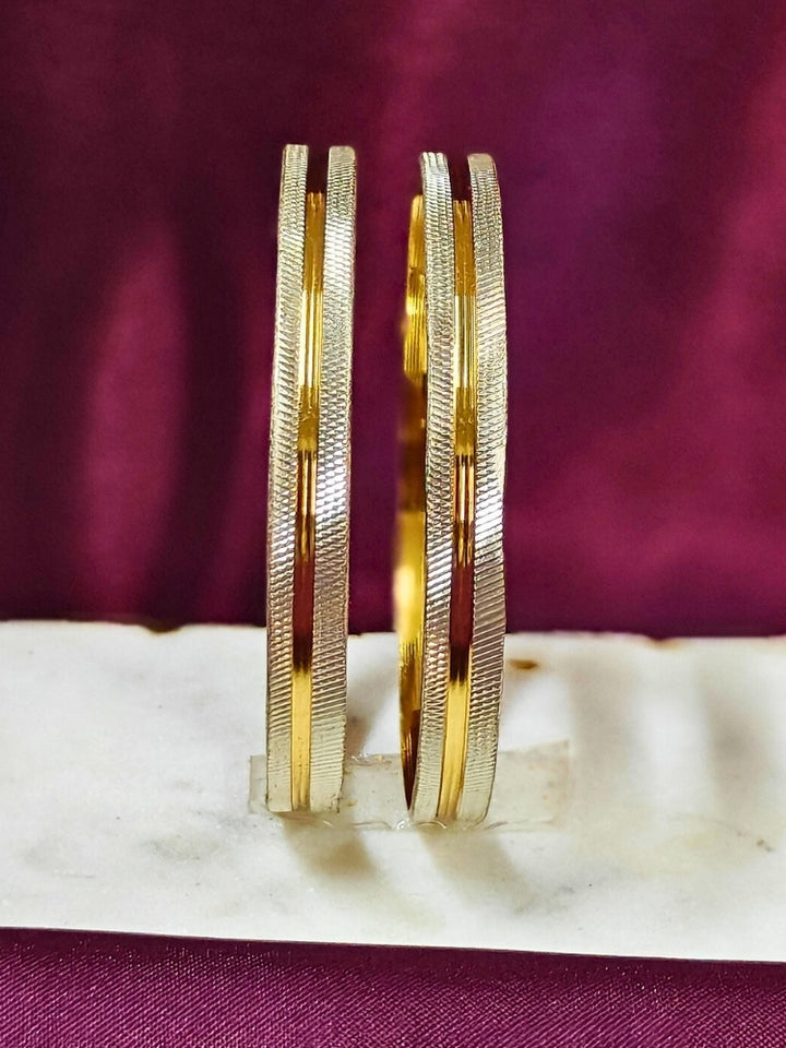 Close-up of an ornate traditional (Gold Polish) White Bangles Set. It’s comfortable and lightweight enough for everyday wear, and it also looks absolutely beautiful and elegant. The design is stylish, the finish is impressive, and it feels really pleasant to wear all day.