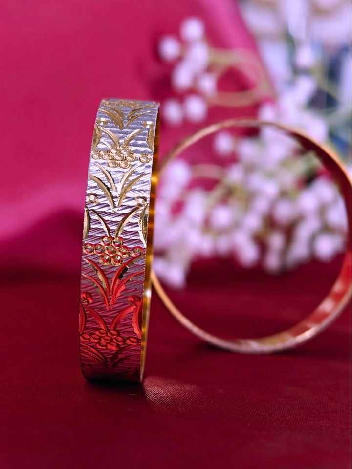 Close-up of an ornate traditional (Gold Polish) Gold & Silver Bangles Set. It’s comfortable and lightweight enough for everyday wear, and it also looks absolutely beautiful and elegant. The design is stylish, the finish is impressive, and it feels really pleasant to wear all day.
