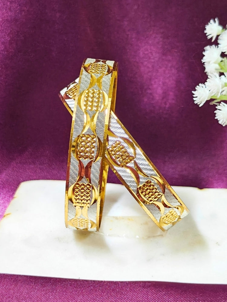 Close-up of an ornate traditional (Gold Polish) Gold & Silver Bangles Set. It’s comfortable and lightweight enough for everyday wear, and it also looks absolutely beautiful and elegant. The design is stylish, the finish is impressive, and it feels really pleasant to wear all day.