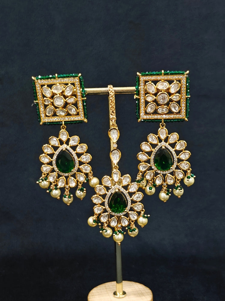 Close-up of an ornate traditional (Gold Polish) Dark Green Choker jewellery set and earrings and maangtikka with Polki, Pearl, Dark Green Colored Stones and Crystal Beads. Woman styling a premium Polki imitation necklace for wedding celebrations. Woman wearing a lightweight Polki jewelry set for long wedding functions.