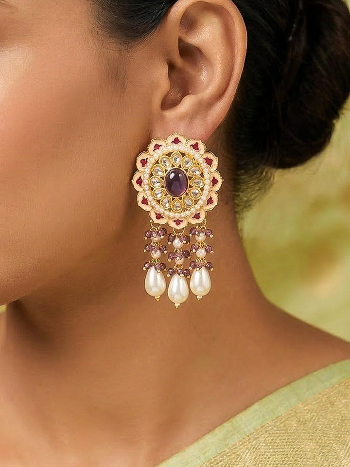 Close-up of a woman wearing an ornate traditional Lilac Rajwadi gold Long jewellery set and earrings with Pearls, Crystal beads, Tumble stones, American Diamonds, Colored Stones, Meenakari work and Pearls. Festive Diwali outfit enhanced with a Rajwadi artificial necklace. Woman wearing a bridal Rajwadi necklace for a reception function. Close-up of enamel work in Meenakari artificial wedding jewelry.