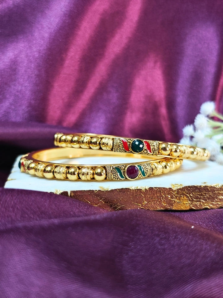 Close-up of an ornate traditional (Gold Polish) White Bangles Set. It’s comfortable and lightweight enough for everyday wear, and it also looks absolutely beautiful and elegant. The design is stylish, the finish is impressive, and it feels really pleasant to wear all day.