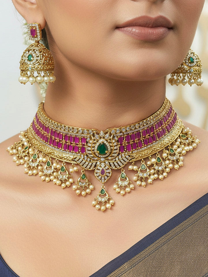 Close-up of a woman wearing an ornate traditional American Diamond gold Pink Choker jewellery set and earrings with  Colored Stones, American Diamond and Pearls. Close-up shot of a high-quality American diamond artificial necklace worn for festive celebrations. Bride wearing a sparkling American diamond necklace for her reception night.
