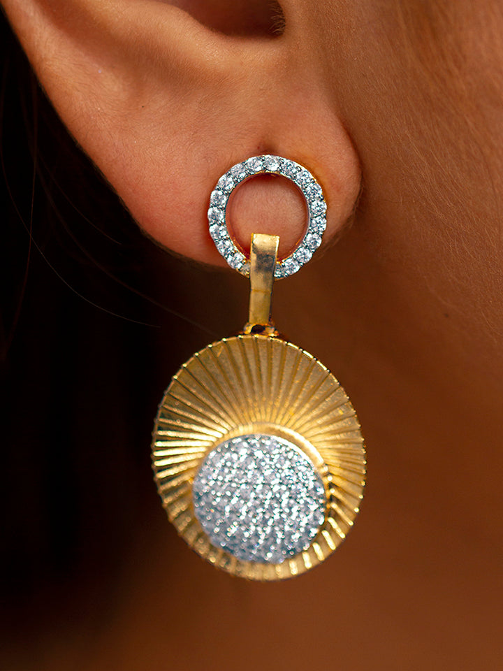 The Kensington Necklace Set is displayed in a box with a gold necklace featuring circular gold and silver accents, sparkling American Diamonds, and matching earrings—all set on black velvet with a satin gold border, perfect for parties.