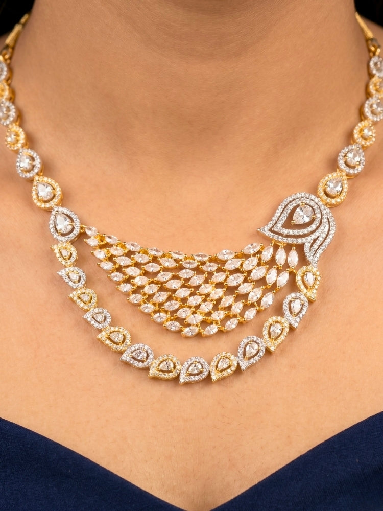 Close-up of a women wearing an ornate Western (Dual Tone) Gold & Silver Collar jewellery set and earrings with American Diamond. Party wear outfit completed with a lightweight American diamond necklace. Close-up of a cocktail party look featuring a premium American diamond necklace.