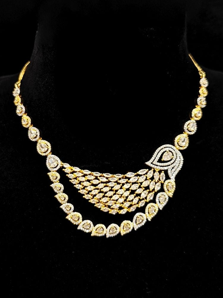 Close-up of an ornate Western (Dual Tone) Gold & Silver Collar jewellery set and earrings with American Diamond. Party wear outfit completed with a lightweight American diamond necklace. Close-up of a cocktail party look featuring a premium American diamond necklace.