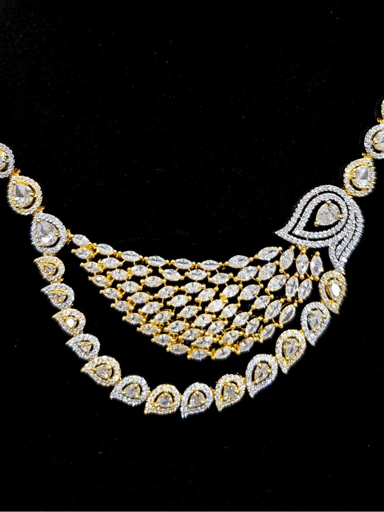 Close-up of an ornate Western (Dual Tone) Gold & Silver Collar jewellery set and earrings with American Diamond. Party wear outfit completed with a lightweight American diamond necklace. Close-up of a cocktail party look featuring a premium American diamond necklace.