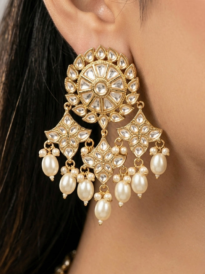 Close-up of a woman wearing an ornate traditional (Gold Polish) Long jewellery set and earrings with Polki and Pearls. Festive saree look completed with a Long Polki artificial jewelry set. Woman wearing trending Polki artificial jewelry for the wedding season in India.