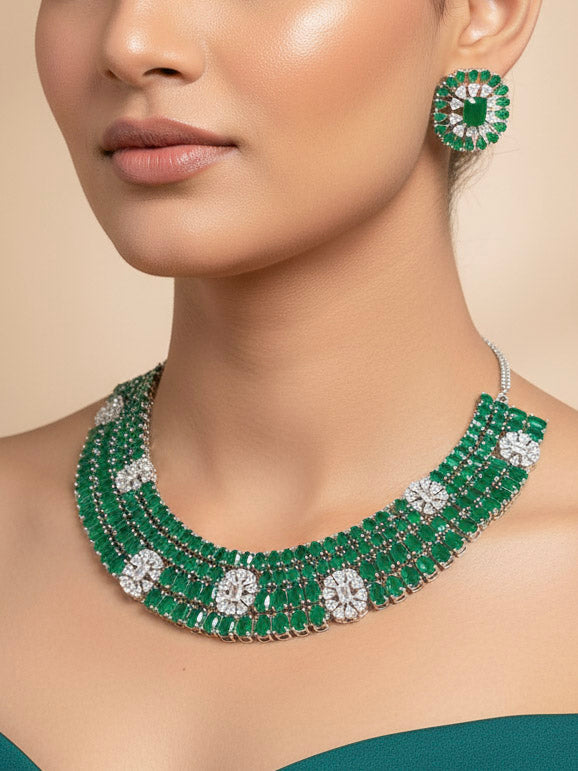 "Close-up of a woman wearing a sparkling artificial diamond and green colored stone  necklace and diamond earrings set, designed to offer a radiant, elegant look for any formal occasion or Indian wedding. This affordable diamond jewelry provides a flawless, luxurious alternative to natural diamonds."
