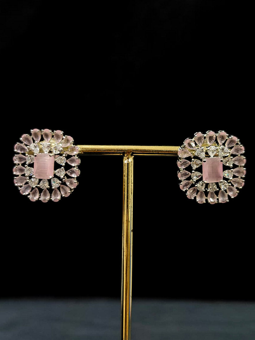 "A glamorous artificial diamond necklace with mint pink colored stone paired with chic earrings, perfect for bridal wear. This high-quality artificial diamond jewelry set is the ideal choice for modern brides looking for a budget-friendly option with timeless sparkle." Reception-ready look featuring a statement American diamond jewelry set.