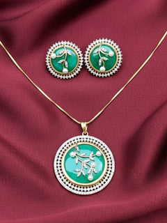 Close-up of an ornate Indo-Western Mint Green Pendant Set with American Diamond, Pearls and Colored Stones. Bride-to-be styled in a premium American diamond artificial Colored Stone Pendant Set for her reception party. Close-up shot of a high-quality Colored Stones artificial Pendant worn for festive celebrations.