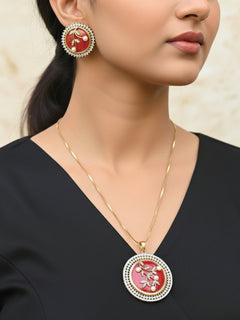Close-up of a woman wearing an ornate Indo-Western Orange Pendant Set with American Diamond, Pearls and Colored Stones. Bride-to-be styled in a premium American diamond artificial Colored Stone Pendant Set for her reception party. Close-up shot of a high-quality Colored Stones artificial Pendant worn for festive celebrations.