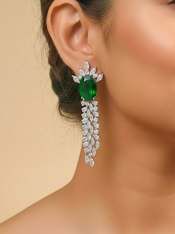 Close-up of a woman wearing an ornate Western Dark Green (Silver Polish) Collar Diamond jewellery set and earrings with Dark Green Colored Stone and American Diamond. Party wear outfit completed with a lightweight American diamond necklace.
Perfect American Diamond necklace set for Cocktail Party and festivals.
