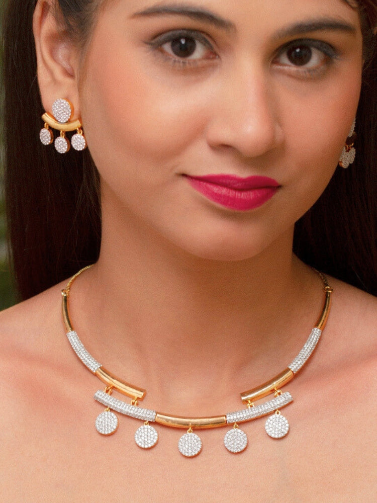 The Lunessa Necklace Set features gold and white tones with round American Diamonds, sparkling atop black velvet. This elegant accessory for cocktail gowns comes beautifully presented in a golden box.