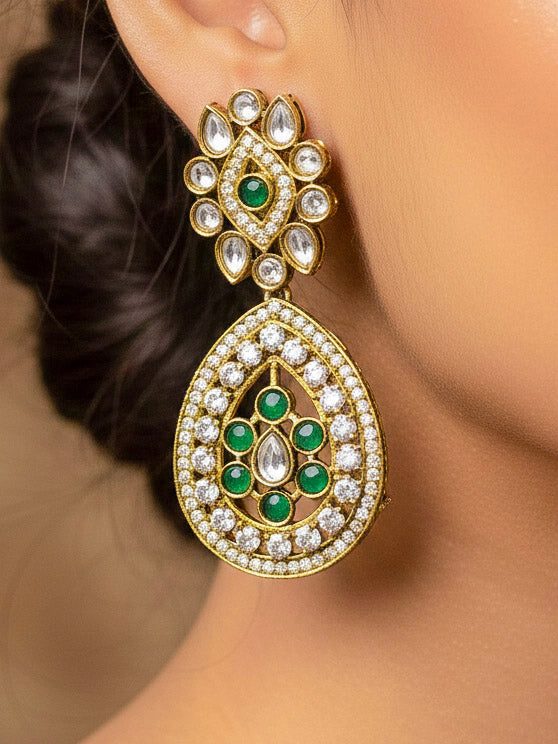 Close-up of an ornate Traditional Dark Green Diamond (Mehendi gold Polish) Hasli jewellery set and earrings with American Diamond and Dark Green Colored Stones. A luxury American diamond necklace set styled beautifully for a wedding guest look in India. Elegant festive look with a high-quality imitation American diamond necklace set.