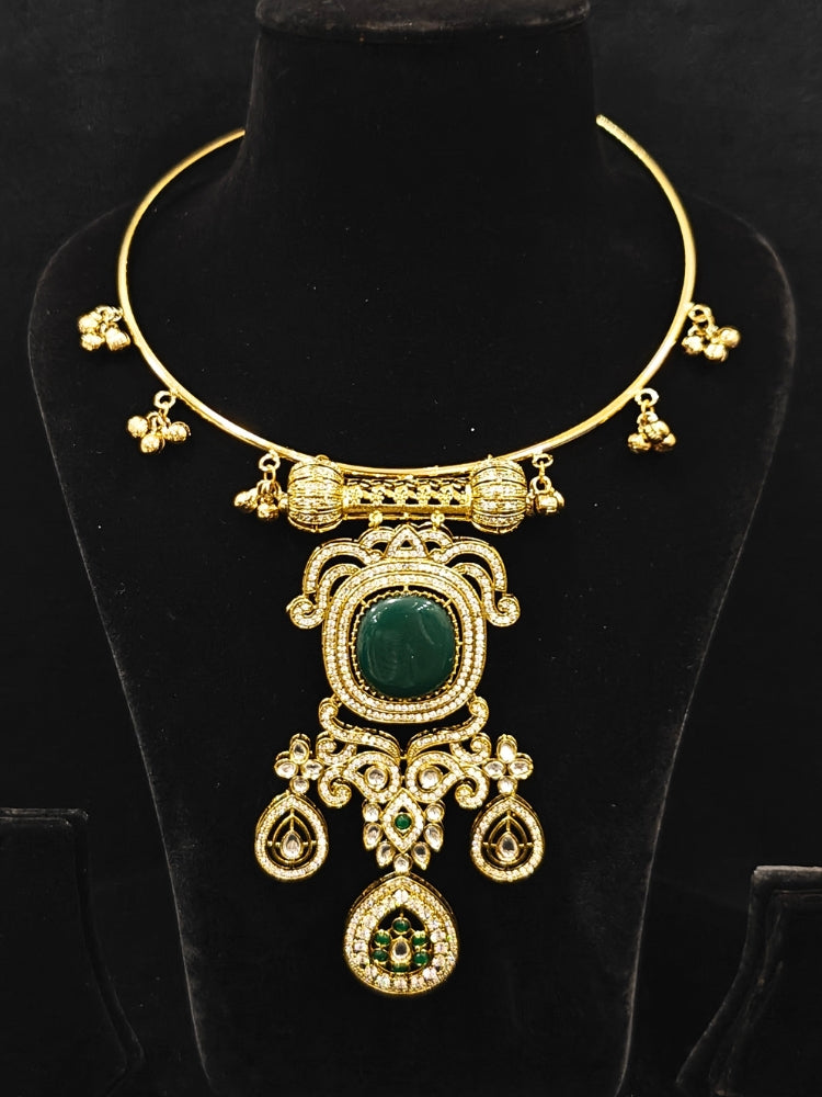 Close-up of an ornate Traditional Dark Green Diamond (Mehendi gold Polish) Hasli jewellery set and earrings with American Diamond and Dark Green Colored Stones. A luxury American diamond necklace set styled beautifully for a wedding guest look in India. Elegant festive look with a high-quality imitation American diamond necklace set.
