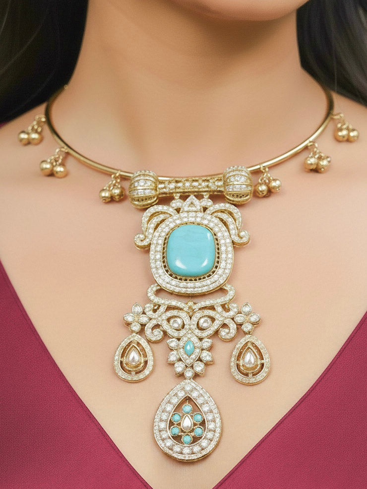Close-up of a woman wearing an ornate Traditional Mint Blue Diamond (Mehendi gold Polish) Hasli jewellery set and earrings with American Diamond and Mint Blue Colored Stones. A woman wearing a luxury American diamond necklace set styled beautifully for a wedding guest look in India. Elegant festive look with a high-quality imitation American diamond necklace set.