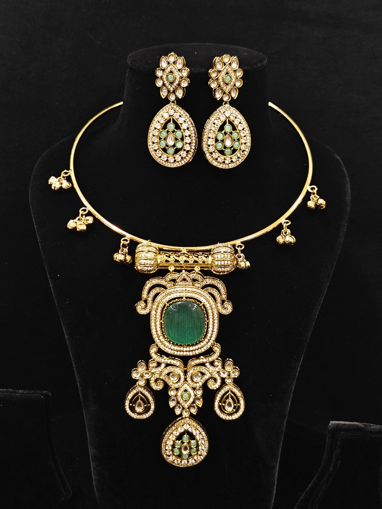 Close-up of an ornate Traditional Mint Blue Diamond (Mehendi gold Polish) Hasli jewellery set and earrings with American Diamond and Mint Blue Colored Stones. A  luxury American diamond necklace set styled beautifully for a wedding guest look in India. Elegant festive look with a high-quality imitation American diamond necklace set.