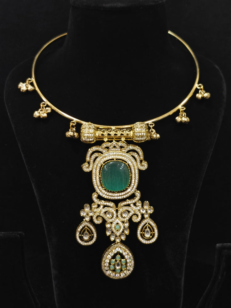 Close-up of an ornate Traditional Mint Blue Diamond (Mehendi gold Polish) Hasli jewellery set and earrings with American Diamond and Mint Blue Colored Stones. A  luxury American diamond necklace set styled beautifully for a wedding guest look in India. Elegant festive look with a high-quality imitation American diamond necklace set.