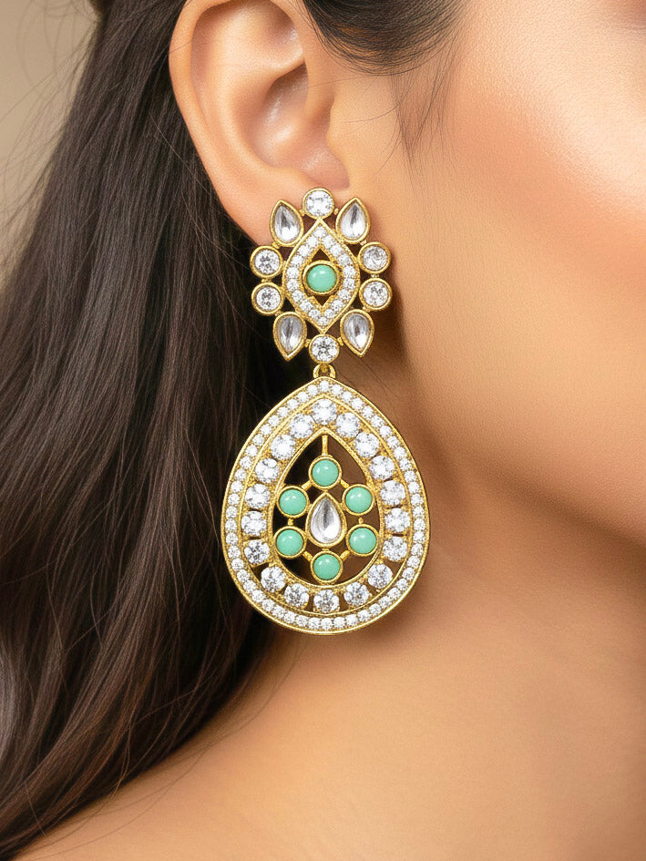 Close-up of a woman wearing an ornate Traditional Mint Green Diamond (Mehendi gold Polish) Hasli jewellery set and earrings with American Diamond and Mint Green Colored Stones. A woman wearing a luxury American diamond necklace set styled beautifully for a wedding guest look in India. Elegant festive look with a high-quality imitation American diamond necklace set.