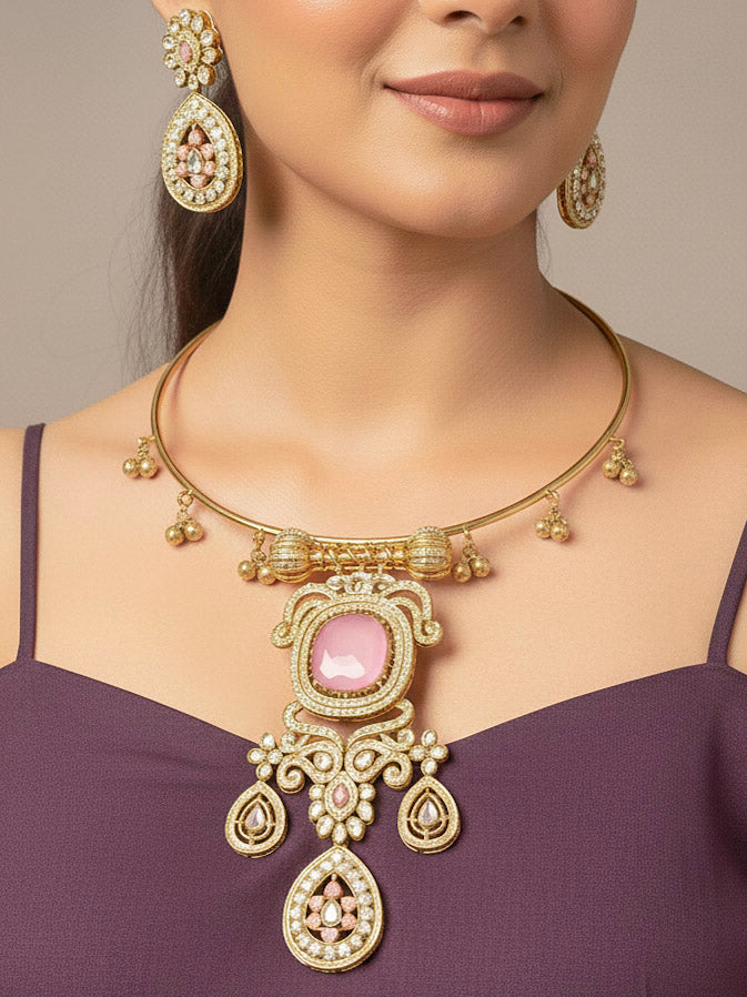 A woman with long dark hair wears a black top and the Lupin Mint Pink Necklace Set, featuring ornate ethnic jewelry with mint pink accents and matching earrings. The hasli necklace set is made in mehendi polish, along with mint pink stones and american diamonds. 
