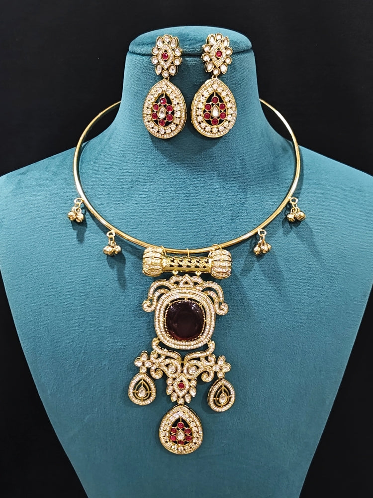 Close-up of an ornate Traditional Red Diamond (Mehendi gold Polish) Hasli jewellery set and earrings with American Diamond and Red Colored Stones. A  luxury American diamond necklace set styled beautifully for a wedding guest look in India. Elegant festive look with a high-quality imitation American diamond necklace set.