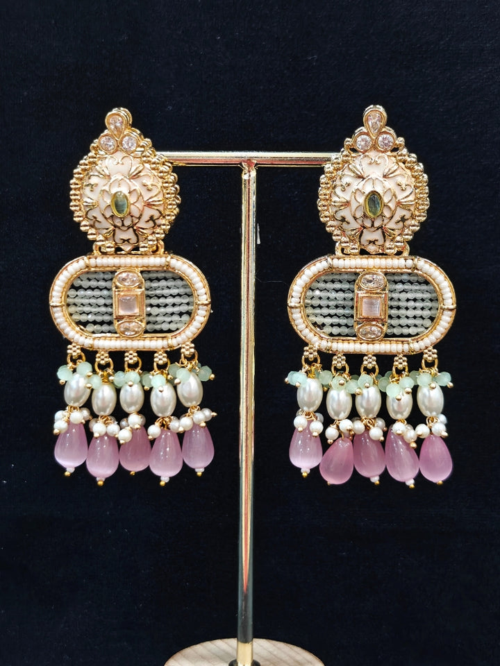Close-up of an ornate traditional Mint Pink and Green Rajwadi gold Long jewellery set and earrings  with  Pearls, Tumble Beads, Meenakari, Moissanite Kundan, Bandhai Work and Hydro Crystals. Close-up of a handcrafted Rajwadi artificial jewelry set . Elegant  look with a traditional Rajwadi artificial necklace. Close-up of a premium Rajwadi artificial necklace under 10000.
