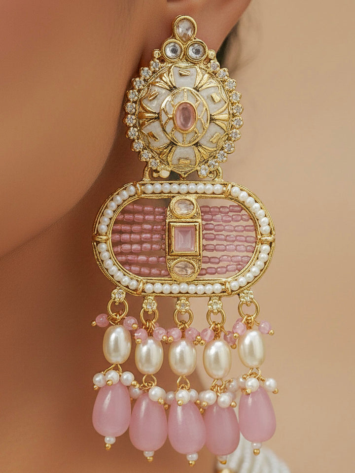 Close-up of a woman wearing an ornate traditional Mint Pink Rajwadi gold Long jewellery set and earrings  with  Pearls, Tumble Beads, Meenakari, Moissanite Kundan, Bandhai Work and Hydro Crystals. Festive look completed with a luxury Rajwadi imitation necklace. Close-up of a premium Rajwadi artificial necklace under 10000. Perfect Rajwadi necklace set for weddings and festivals.