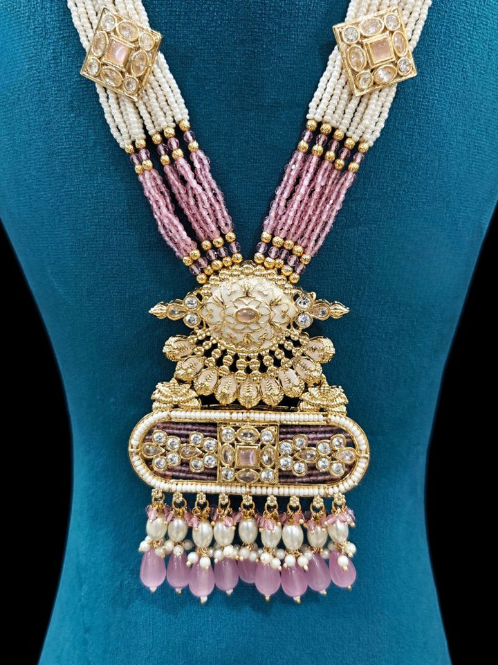 Close-up of an ornate traditional Mint Pink Rajwadi gold Long jewellery set and earrings  with  Pearls, Tumble Beads, Meenakari, Moissanite Kundan, Bandhai Work and Hydro Crystals. Festive look completed with a luxury Rajwadi imitation necklace.  Perfect Rajwadi necklace set for weddings and festivals.