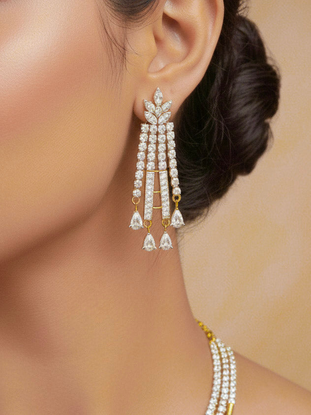 Close-up of a woman wearing an ornate Western gold Diamond Collar jewellery set and earrings with American Diamond. Woman styling a statement American diamond necklace with an off-shoulder gown for a reception. 
