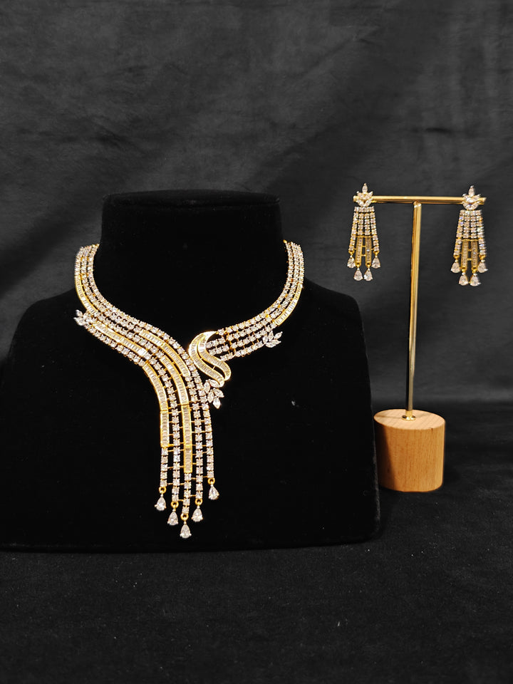 Close-up of an ornate Western gold Diamond Collar jewellery set and earrings with American Diamond. Close-up of a cocktail party look featuring a premium American diamond necklace. Perfect Necklace Set for Party wear.